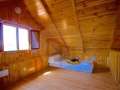 Two houses in a rustic building with its own well