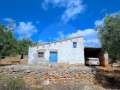 Two houses in a rustic building with its own well