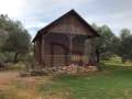 Two houses in a rustic building with its own well