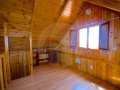 Two houses in a rustic building with its own well